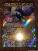Clear image of the Great Tusk EX holographic foil full art Pokémon trading card showing Pokémon name, HP 250, attacks, and holo foil star effects.