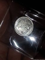 Silver round with eagle design, marked USA 999 Fine Silver.