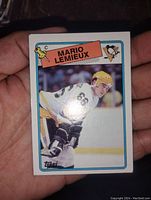 Front of the Mario Lemieux hockey card showing the player in Pittsburgh Penguins uniform with Topps branding.