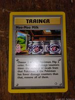 Front of Moo Moo Milk Pokemon Trainer card showing card art, text, and condition.