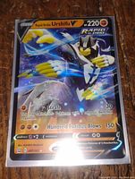 Front close-up of Urshifu V Rapid Strike full art Pokemon card showing holographic details and move text.