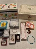 Full lot overview showing all jewelry and jewelry boxes