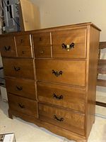 Side view of the full dresser showing wood finish and drawer arrangement