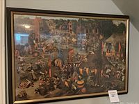 Full view of the framed canvas wall art depicting Pieter Bruegel the Elder's The Fight Between Carnival and Lent.