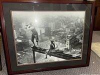 Full view of the framed golf print showing two men on a steel beam above New York City buildings.