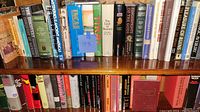 Books with titles relating to archaeology and ancient civilizations, arranged on a bookshelf.