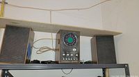 Front view of the Telefunken stereo system with central control unit and two speakers on either side