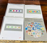 Four Canada souvenir stamp albums from 1978, 1979, 1980, and 1981 displayed together.