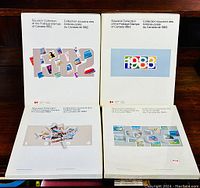 Four hardcover souvenir stamp albums for years 1982, 1983, 1984, and 1985 arranged side by side, showing their distinct colorful year designs on the covers.