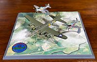 Three diecast model aircraft on a scenic aerial map base: B17 Flying Fortress Sally B, P-51 Mustang, and P-47 Thunderbolt with clear stands and military markings.