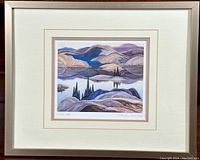Framed print of the Mirror Lake artwork with a cream and beige mat and simple silver frame.