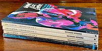 Four Eric Clapton guitar tablature books stacked horizontally showing spines with titles and volume numbers