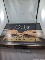 Box of 1995 Parker Brothers Ouija Board with hands and planchette image