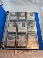 Page displaying nine Magic The Gathering cards from the Alliances set in protective sleeves.