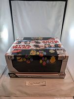 Boxed set of 9 Star Wars Glow Buddies collectible light-up figures showing full packaging with Star Wars branding and graphics of characters.