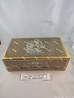 Front and top view of the sealed Konami Yu-Gi-Oh! Yugi's Legendary Decks box in brown and gold with Egyptian hieroglyphic themed packaging and character illustration sealed with Konami shrink wrap.