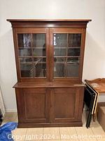 Front view of complete two-piece hutch, doors closed
