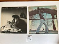 Front covers of 'The Stranger' and 'Glass Houses' albums showing artwork and titles.