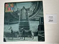 Front cover of Blue Öyster Cult Extraterrestrial LIVE album featuring detailed sci-fi illustration with two dogs and robed figure.