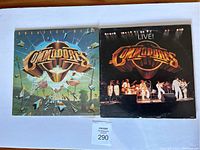 Front covers of both albums side by side showing album artwork and band logo