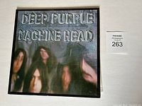 Front cover of Deep Purple Machine Head LP showing band faces and silver embossed album title.