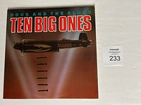 Front cover of Doug and the Slugs 'Ten Big Ones' vinyl LP album showing album title, band name, and artwork of submarine and screws.