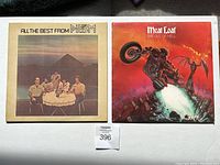 Front view of both LP album covers: 'All the Best from Prism' and 'Bat Out of Hell' by Meat Loaf, showing artwork and titles.
