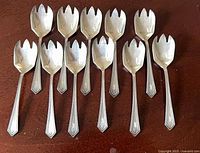 All eleven sterling Richmond spoons displayed bowl up