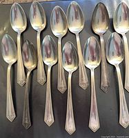 Front view of 12 Alvin Richmond sterling teaspoons