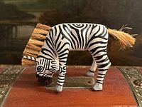 Left profile of zebra alebrije showing stripes, mane, size reference