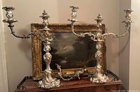 Pair of sterling silver Rococo candelabras displayed assembled