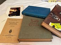 Group shot of six art books laid out