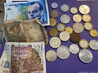 Group shot showing banknotes and majority of coins