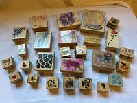 All 25 wood-mounted rubber stamps arranged face up