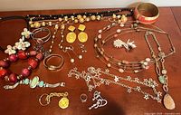Overview of all jewelry items laid out on table