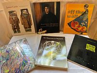 Group shot of all six art books