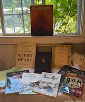 Overall lot showing Ancient Egypt book and eight others on table