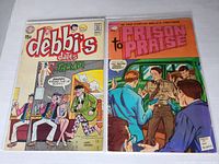 Photo showing front covers of two vintage 1970s comics: Debbi's Dates #10 on left, and Prison to Praise #1 on right. Both comics exhibit wear from age and handling.
