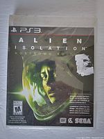Front of factory sealed Alien Isolation Nostromo Edition PS3 game showing artwork and ESRB rating.