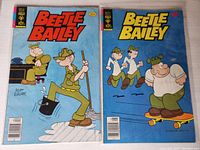 Photo of two Beetle Bailey comic books, issues #120 and #121 from Gold Key Comics, showing front covers with characters and titles.