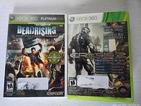 Front cover of Dead Rising Platinum Hits Xbox 360 case alongside Crysis 2 Limited Edition Xbox 360 case showing artwork and branding.