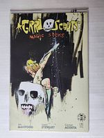 Front cover of Grrl Scouts Magic Socks #1 comic, showing variant cover art by Jim Mahfood with stylized figures and skull.