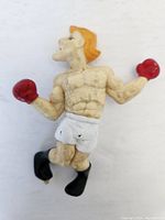 Front angled view of Glass Joe figure displaying muscular build, red gloves, white shorts, and orange hair with visible age wear and dirt.