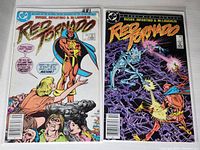 Photo showing two comic books, Red Tornado issues #3 and #4 from 1985 by DC Comics, stacked side-by-side on a gray carpeted surface.
