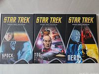 Front cover of three Star Trek graphic novel volumes 4, 5, and 6 showing key characters and series branding.