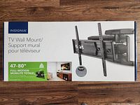 Box showing the front packaging with Insignia branding and product image of the full-motion TV wall mount for 47-80 inch TVs.
