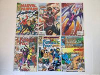 Photo showing six Marvel comic books including three Fantastic Four issues, Marvel Fanfare, Gambit, and an X-Men comic.