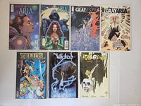 Photo of seven Image Comics issues on a white surface, showing front covers clearly.