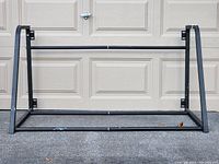 Front view of assembled Motomaster wall-mounting tire rack frame.