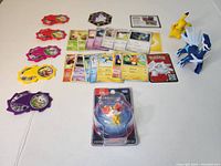 Full lot including cards, figures, tags, and sealed figure package